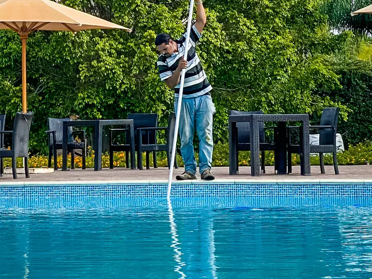 Joe Bennett, owner of Blue Horizon Pools, servicing a pool