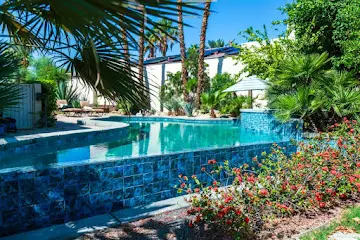 Custom pool with colorful landscaping